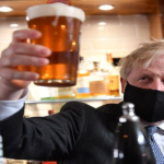 Boris Johnson enjoys his first pint after the shutdown