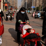 China allows couples to have up to three children