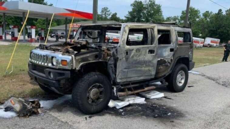 A Hummer vehicle is engulfed by fire due to panic caused by gas shortages