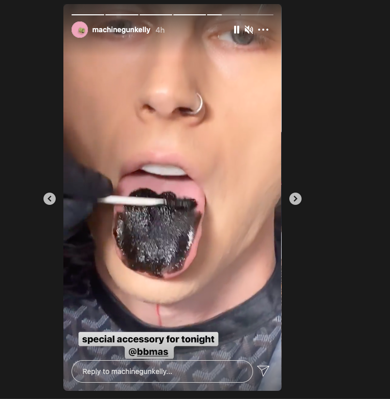 Machine Gun Kelly has painted his tongue black for the Billboard Awards