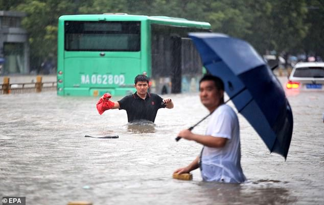 At least 12 dead in China's worst floods in 1,000 years