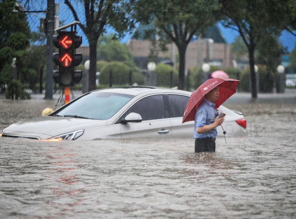 At least 12 dead in China's worst floods in 1,000 years