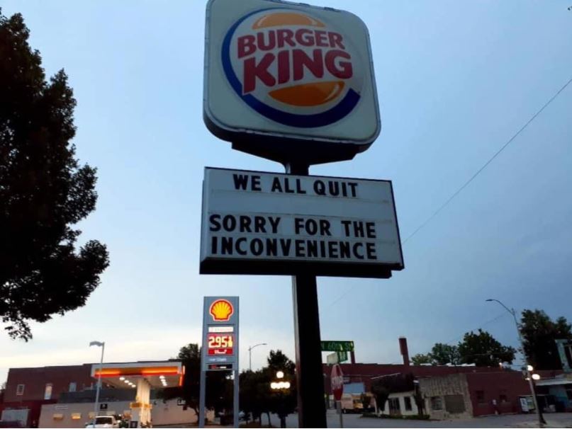 Burger King workers write 'we all quit' on a sign