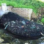 A netted drainage network retains plastics and debris in Australia