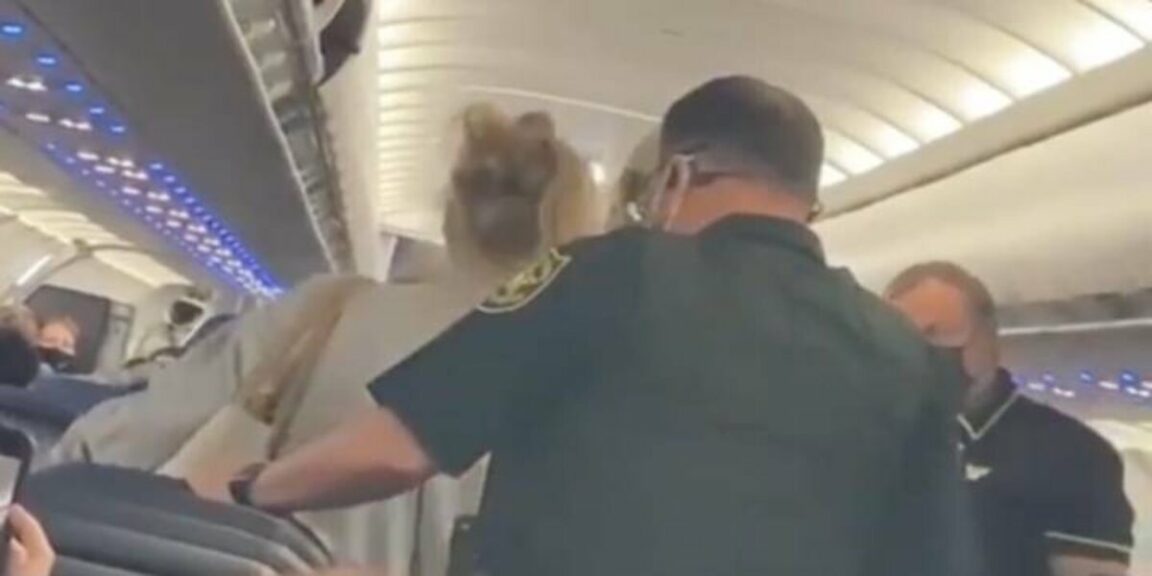 A woman was detained in the United States after lighting a cigarette on a plane