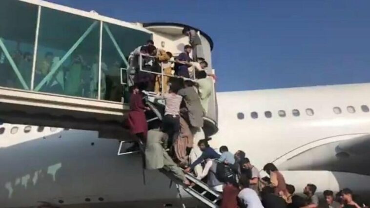 Desperate Afghans try to board flights to escape Taliban