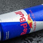 A teenager who drinks 12 cans of Red Bull a day was admitted to hospital after suffering heart cramps