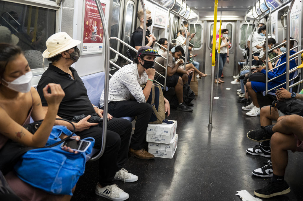 A father and his young daughter were spat on and threatened by a passenger after asking him to stop smoking marijuana on the train