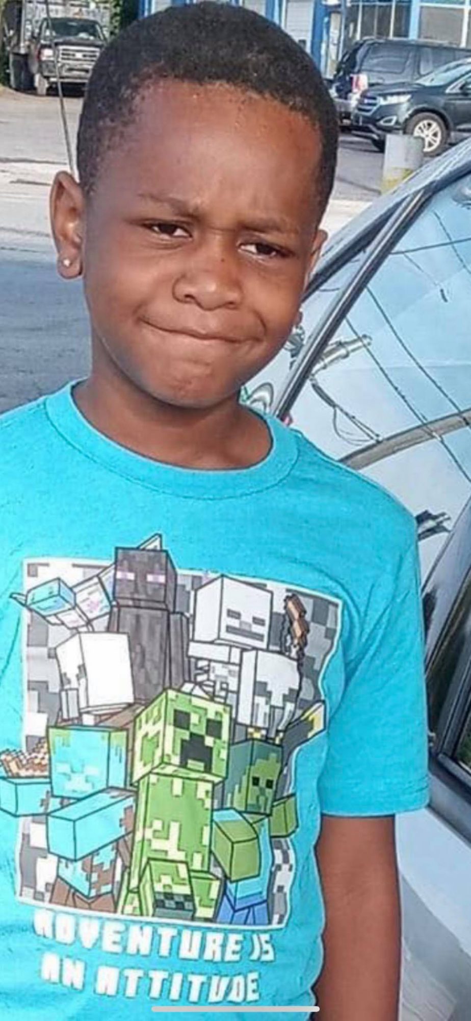An 8-year-old boy is fatally shot while playing on the porch of his home when assailants shoot a man in the yard