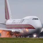 Landing plane bursts into flames at UK airport