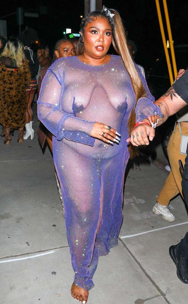 Lizzo looks amazing in a sheer mesh dress as she makes her way to Cardi B's birthday party