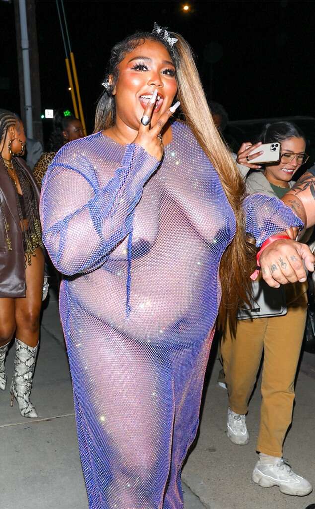 Lizzo looks amazing in a sheer mesh dress as she makes her way to Cardi B's birthday party