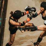 A female MMA fighter is beaten into submission by a male opponent in a mixed-gender bout screened in Poland