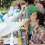 Chinese city pays $1,570 to those who test positive for coronavirus