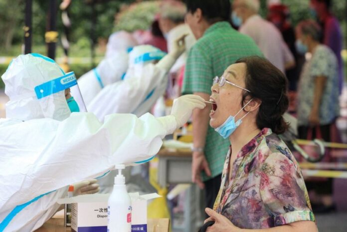 Chinese city pays $1,570 to those who test positive for coronavirus