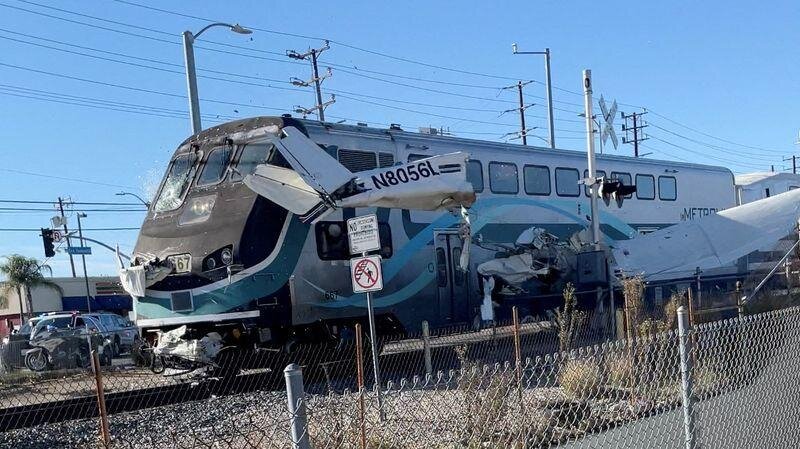 A small plane crashed onto the train tracks and was then run over by the train